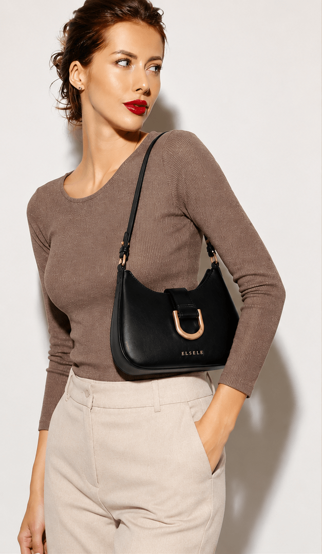 Lunara Black Leather Shoulder Bag – Short Strap Woman wearing the Lunara black leather shoulder bag under the arm