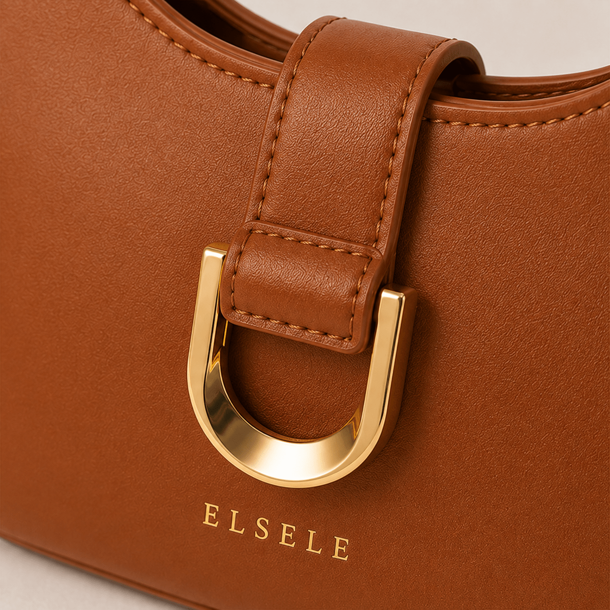 Front hardware detail of the Lunara Brown Leather Shoulder Bag