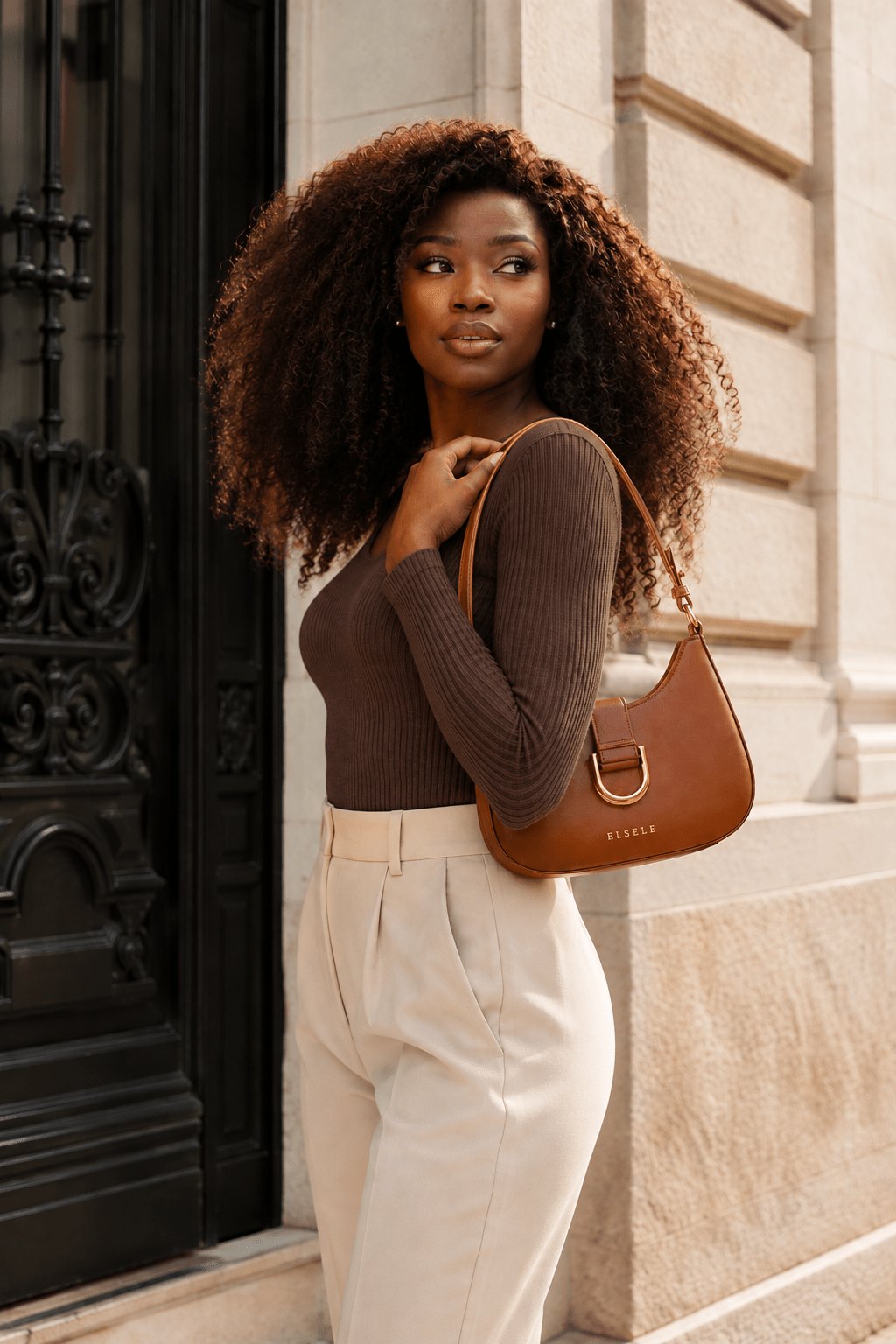 Woman wearing the Lunara Brown Leather Shoulder Bag