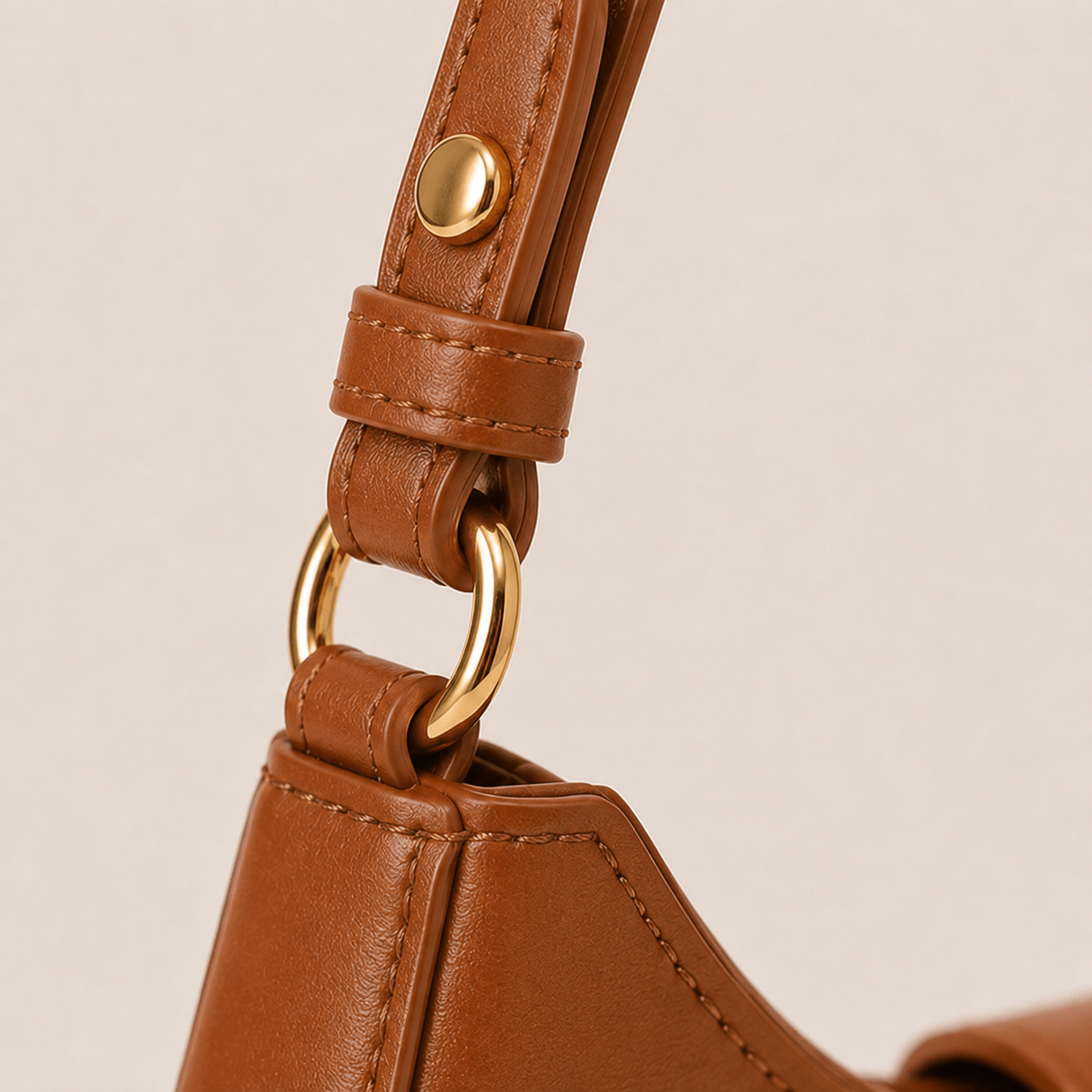 Gold-tone strap hardware on the Lunara Brown Leather Shoulder Bag