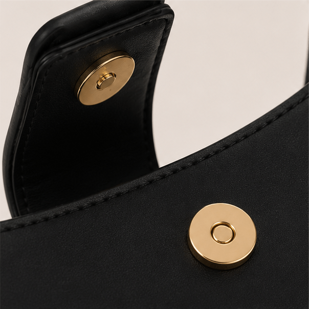 Lunara Shoulder Bag – Magnetic Closure Detail Gold-tone magnetic closure detail inside the Lunara black leather shoulder bag