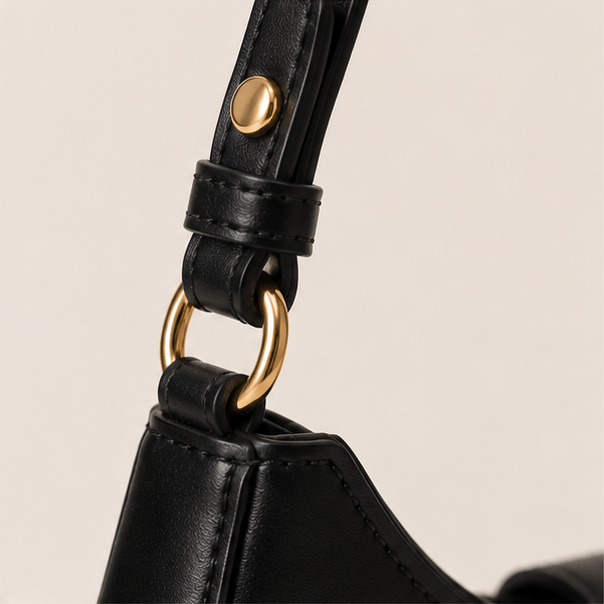 Lunara Shoulder Bag – Strap Attachment Detail Gold-tone ring and adjustable strap attachment on the Lunara shoulder bag